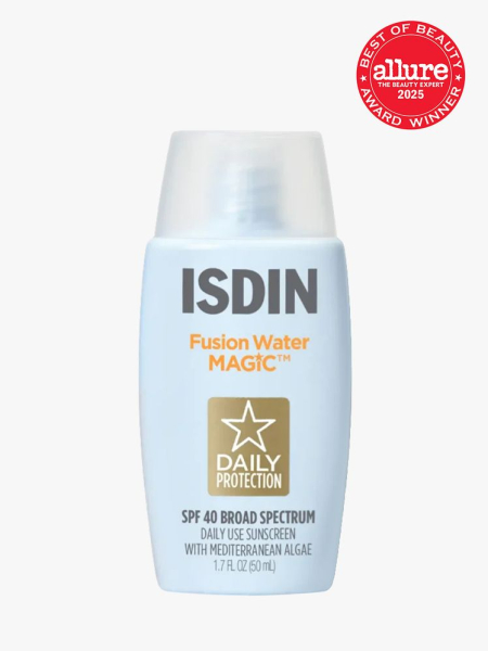 Isdin Fusion Water Magic SPF 40 in branded blue bottle with clear cap on light gray background with red Allure Best of Beauty seal in the top right corner
