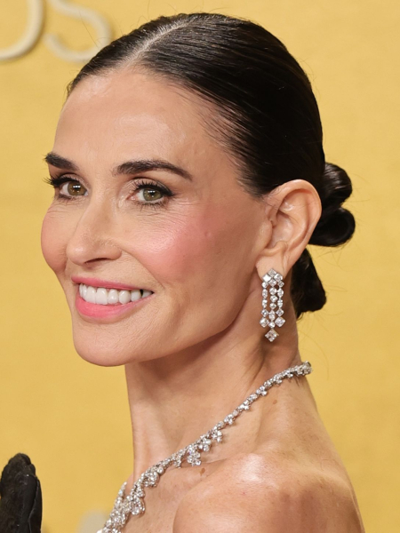 Demi Moore smiling in diamond jewelry